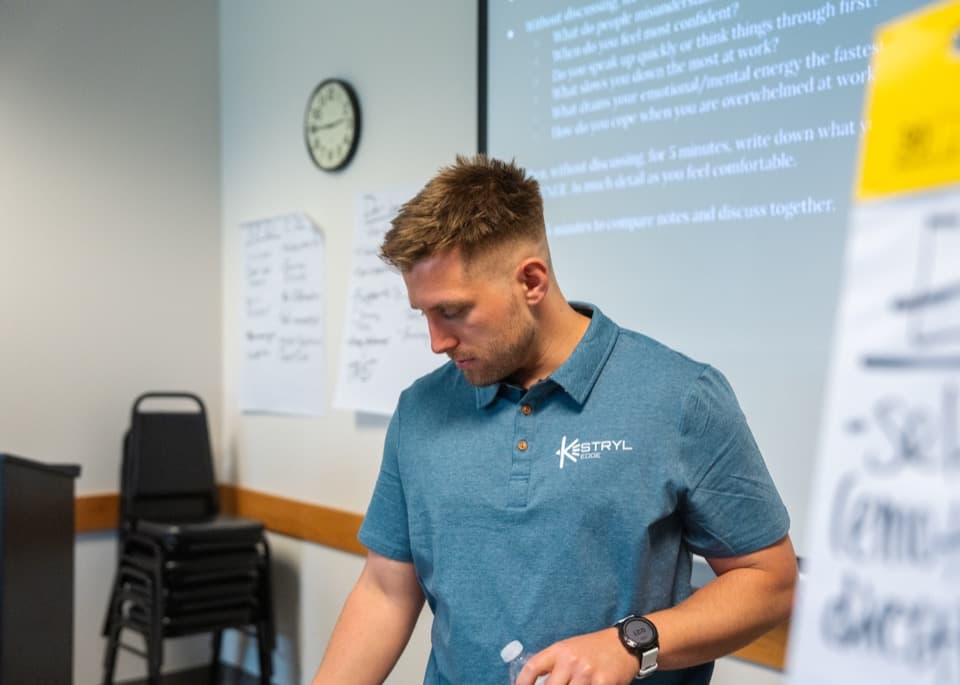 Dan Korus reviewing notes during a Kestryl Edge workshop session