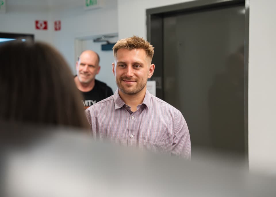Dan Korus listening attentively during a workshop
