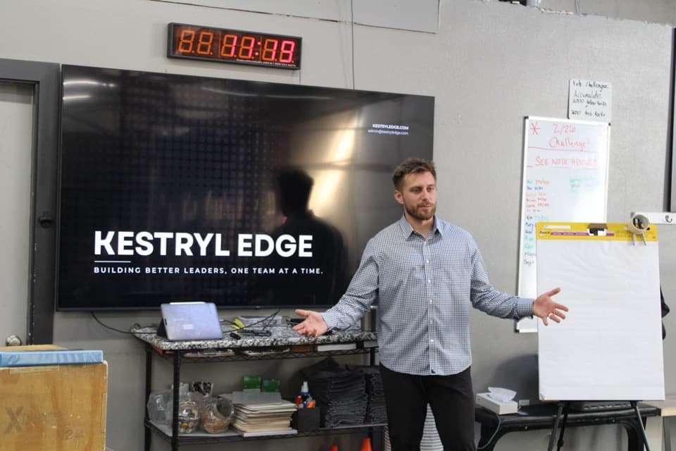 Dan Korus presenting in front of the Kestryl Edge brand screen